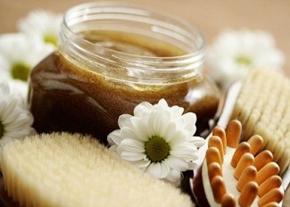 jar of body scrub and massager - beauty treatment