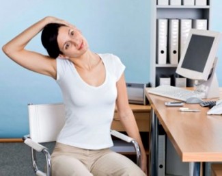 Woman doing yoga in office